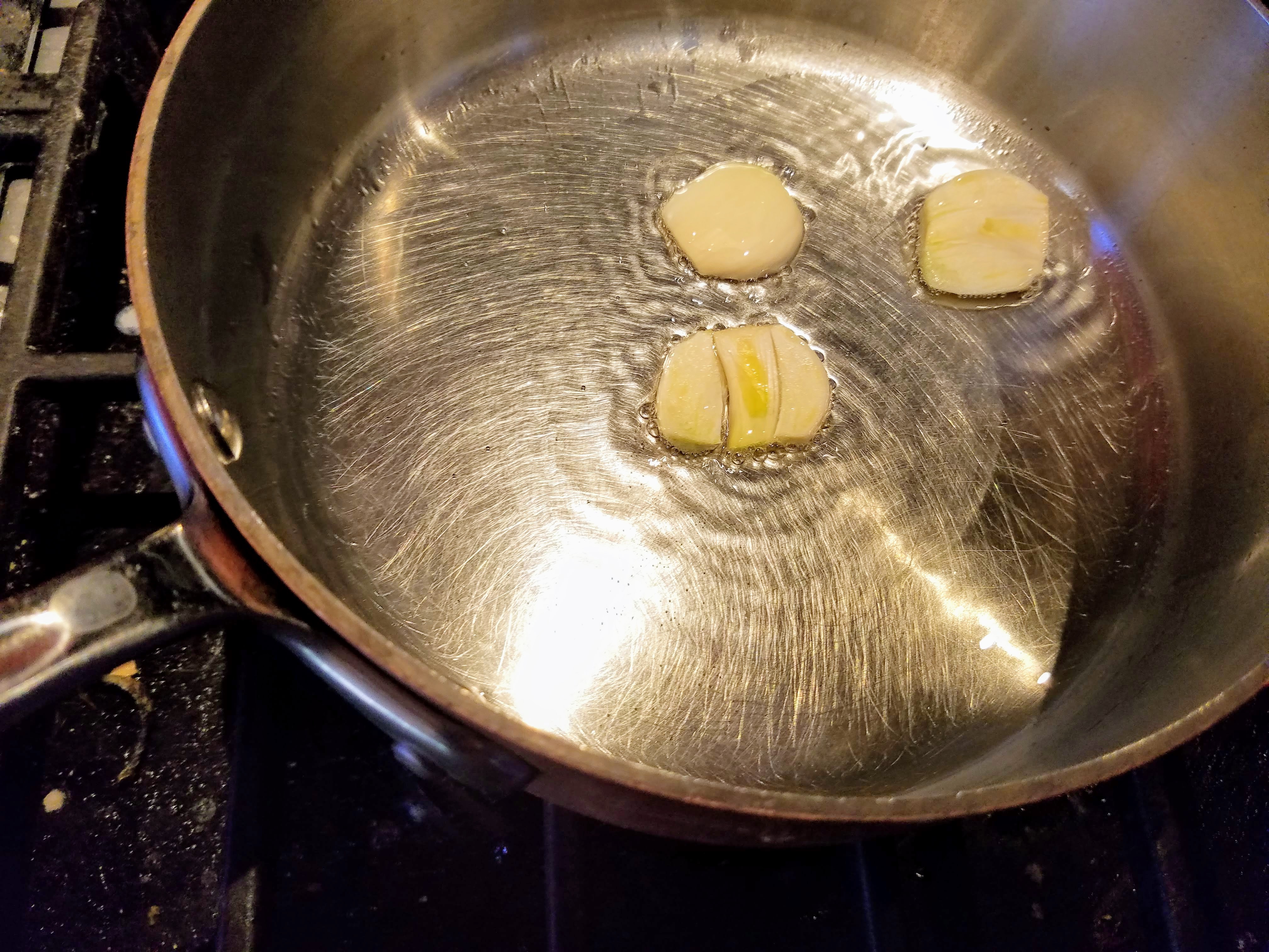 heat garlic in oil