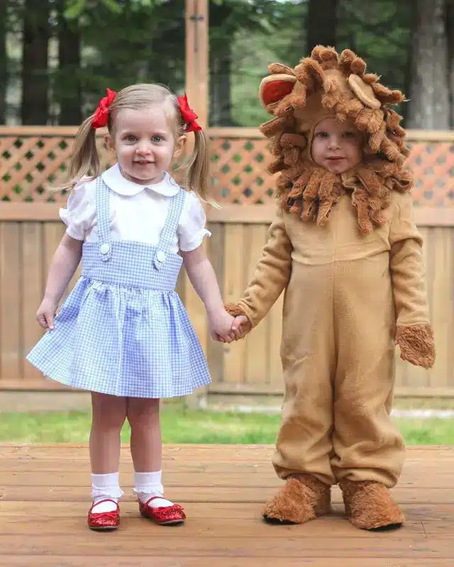 Twin Halloween costume idea using Dorothy and the Lion from The Wizard of Oz.