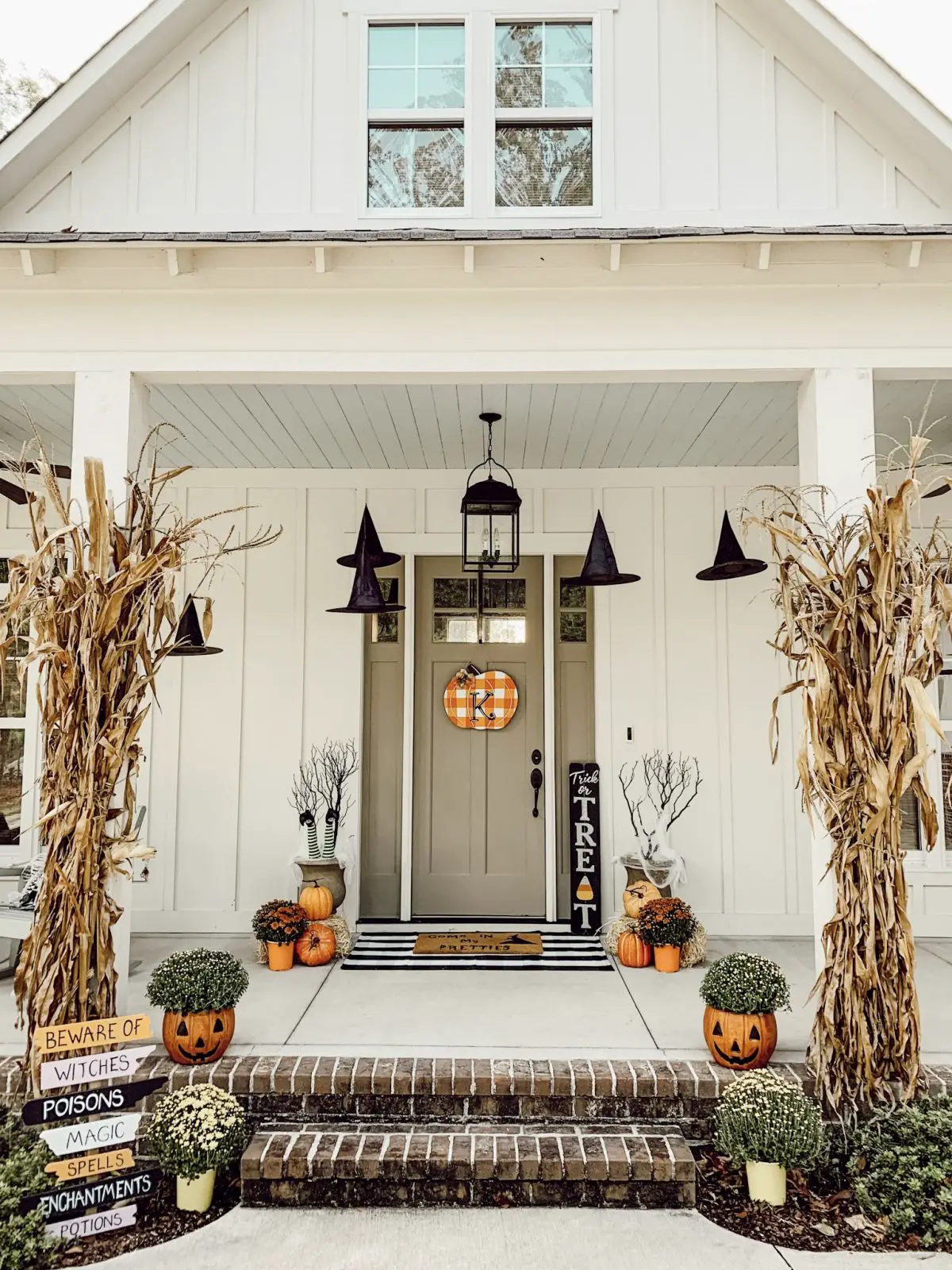 Decorating your front porch with witch hats is one of the Halloween porch ideas in this post. 