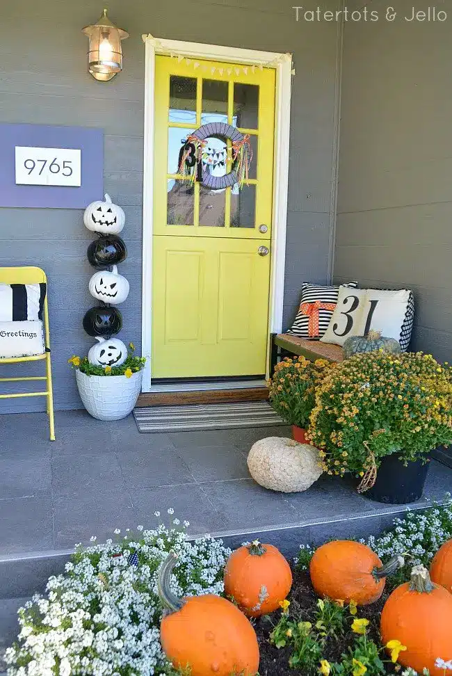 Decorate porch with black and white pumpkins