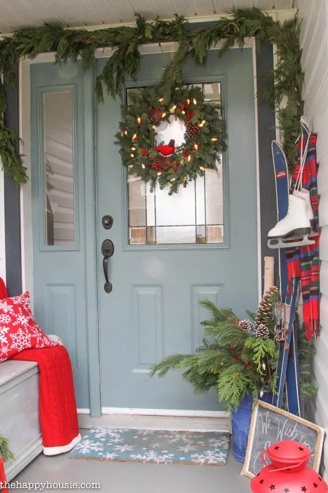 Decorate your porch with skis and ice skates for Christmas
