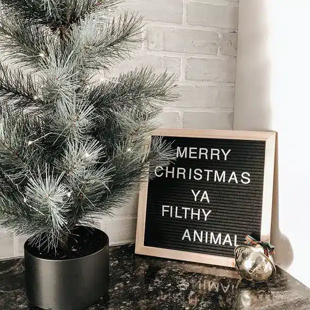 letter board that says "merry christmas ya filthy animal"