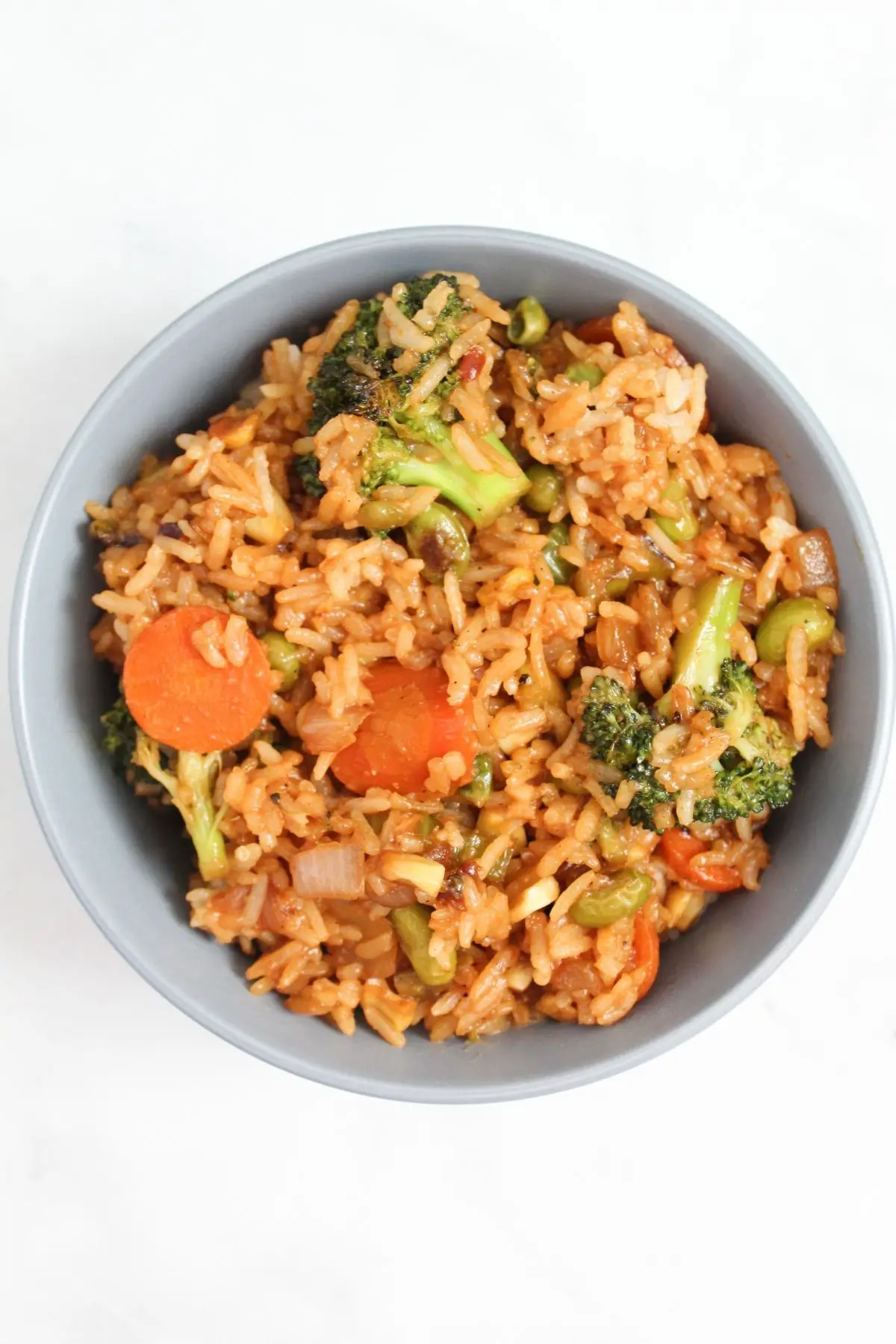 top down view of finished vegan fried rice with broccoli, carrots, and other veggies