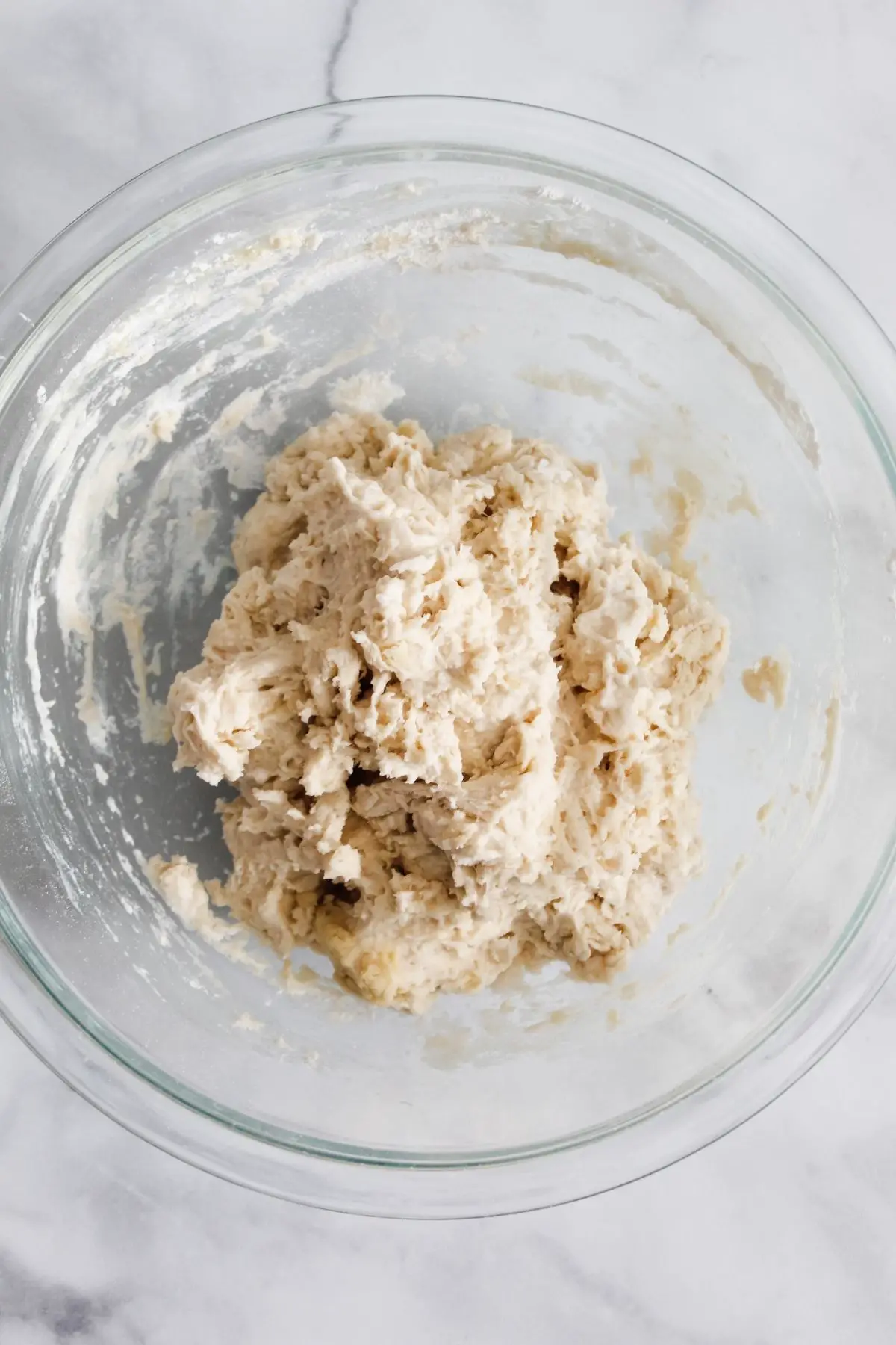 Add flour, salt, and olive oil to your yeast mixture