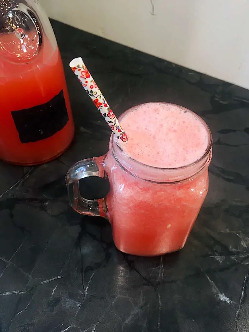 fizzing bubbles of watermelon limonade drink