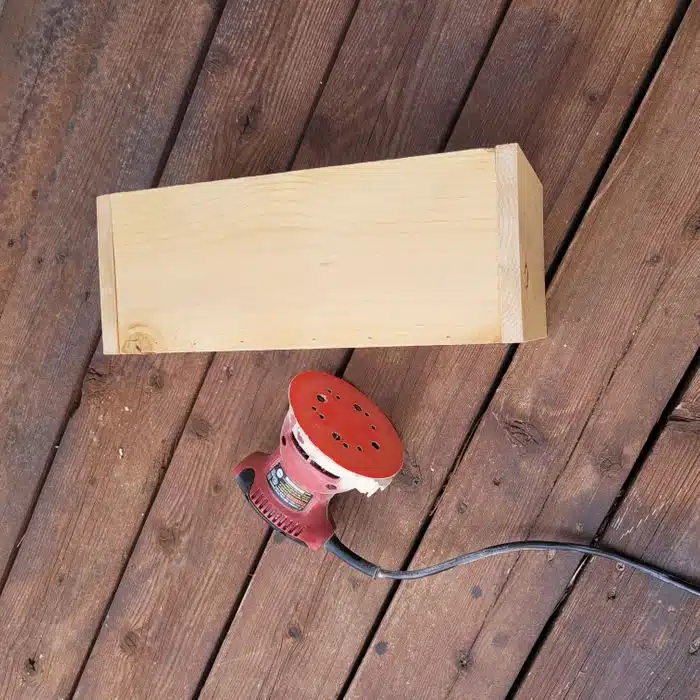 sanding a DIY centerpiece box