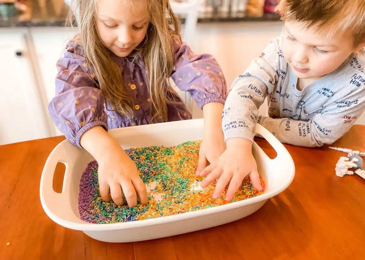 My daughter and son playing with the rice.