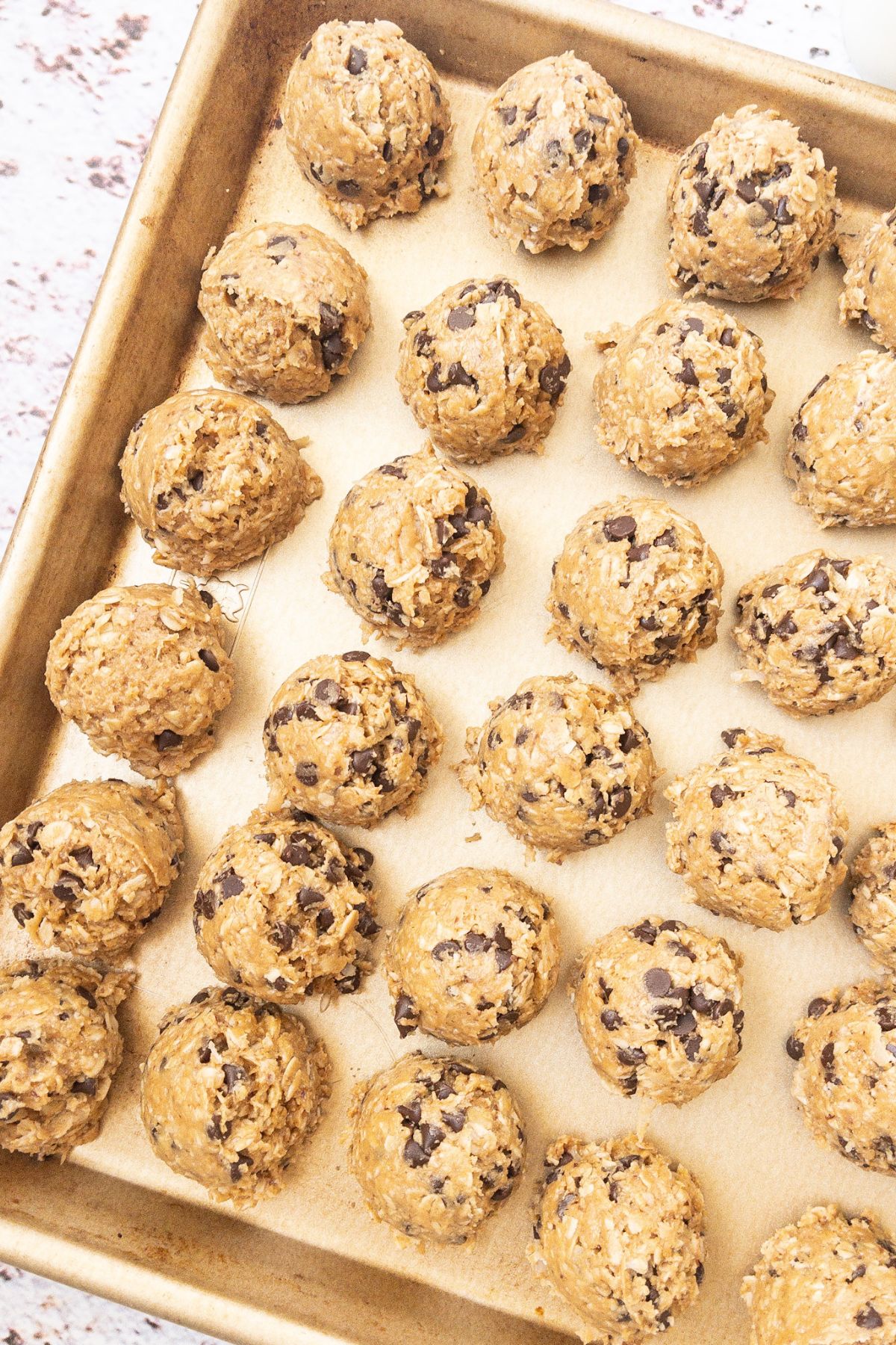 Protein balls on a cookie sheet.