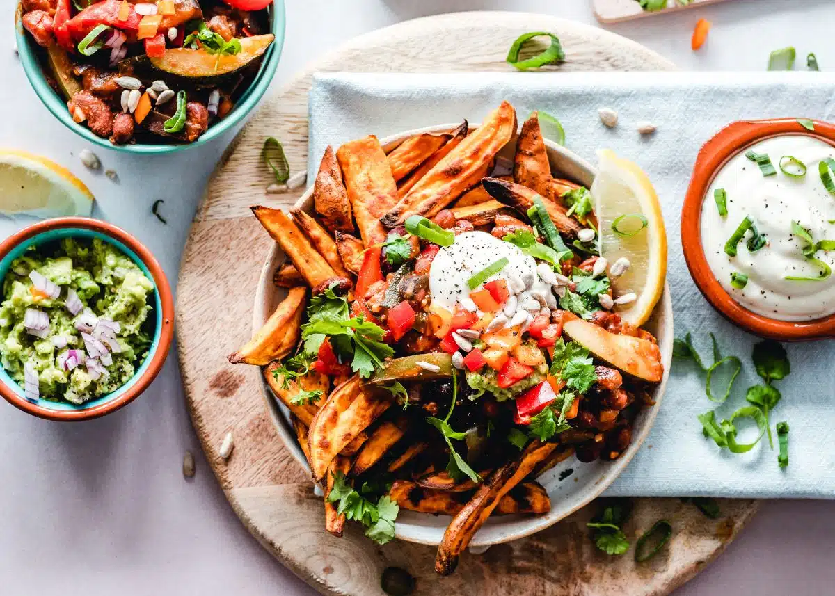 A bunch of bowls with Mexican food.