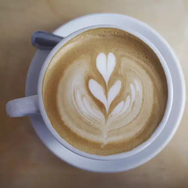 Flat lay shot of a latte with heart-shaped cream