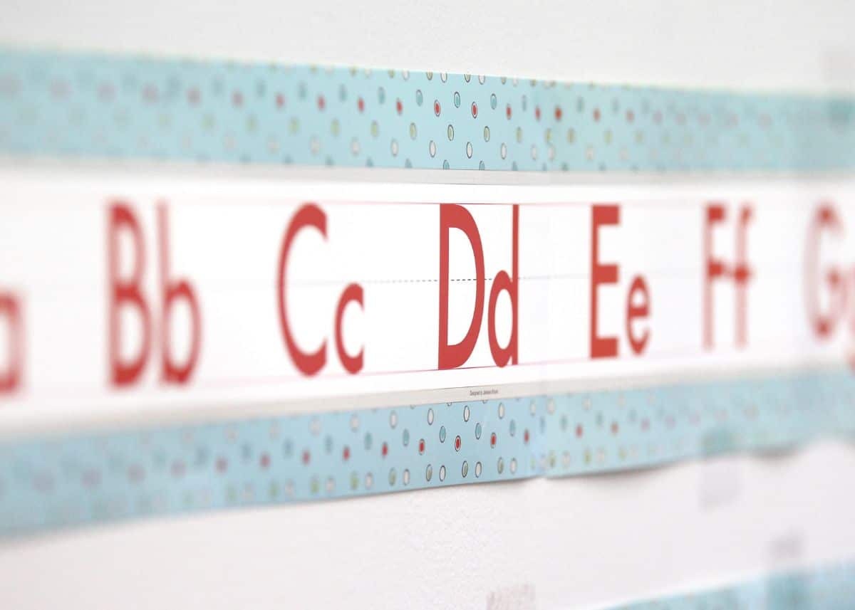 This is a closeup of an alphabet banner in a classroom.  The letters B, C, D, E, F, and G are visible.