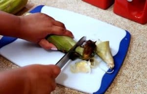 cut the corn for Belizean Dukunu Recipe