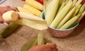 husk the peel for Belizean Dukunu Recipe