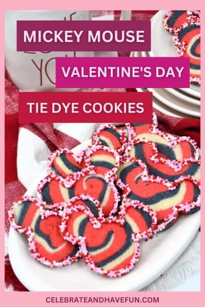 valentine's day tie dye mickey mouse cookies on a platter with holiday decorations around it