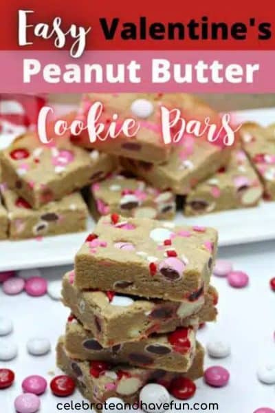 valentines day peanut butter cookie bars on a plate surrounded by chocolate candies