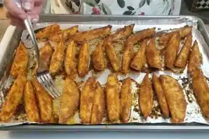 Bake the potato wedges in the preheated oven