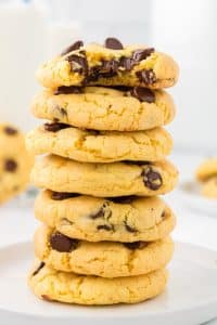 yellow cake mix cookies stacked on top of each other with gooey chocolate chips