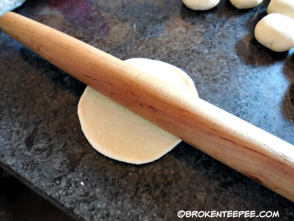 roll each dough ball into a circle about 1/8" thick