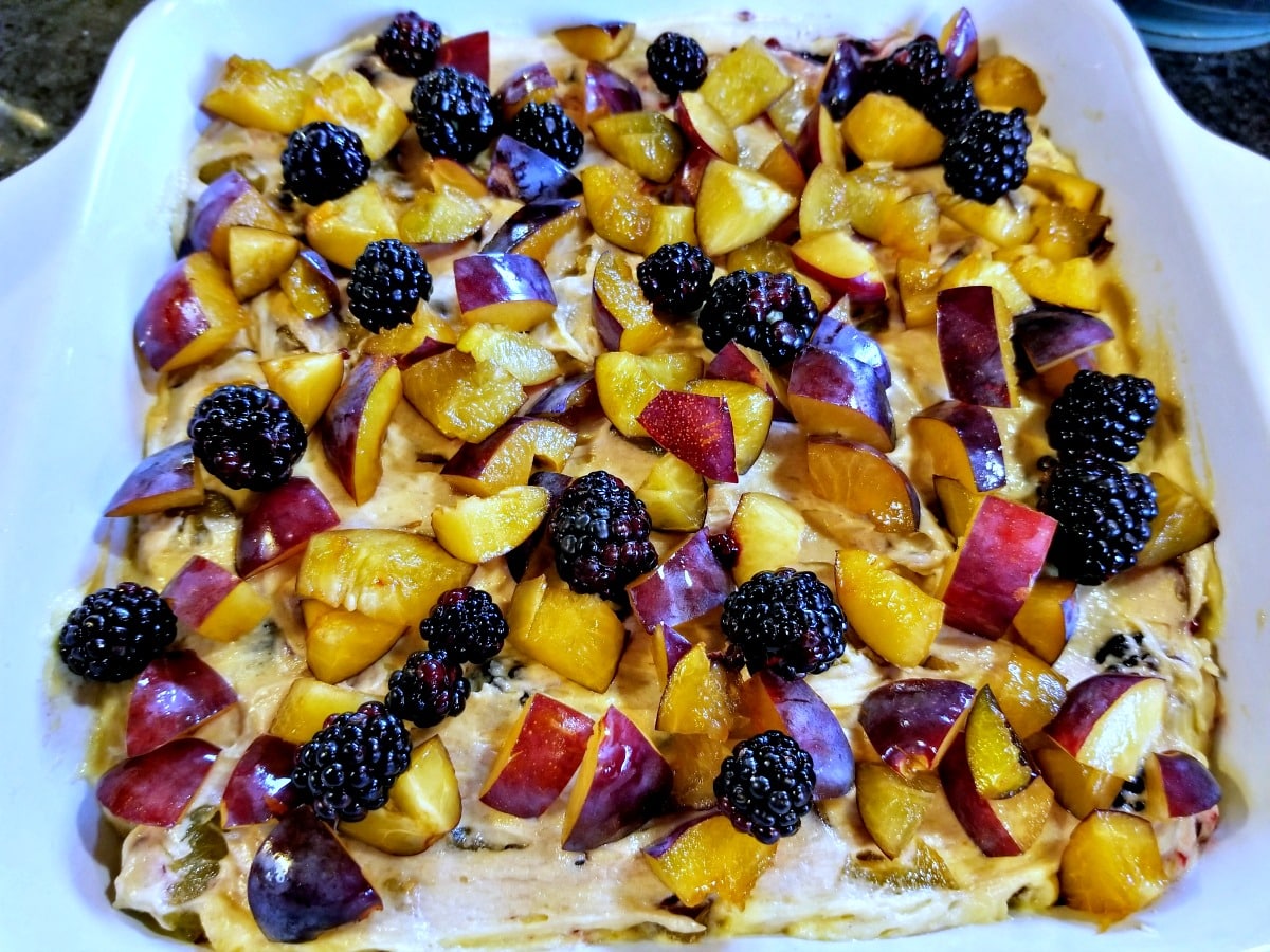 add remaining fruit to batter in pan
