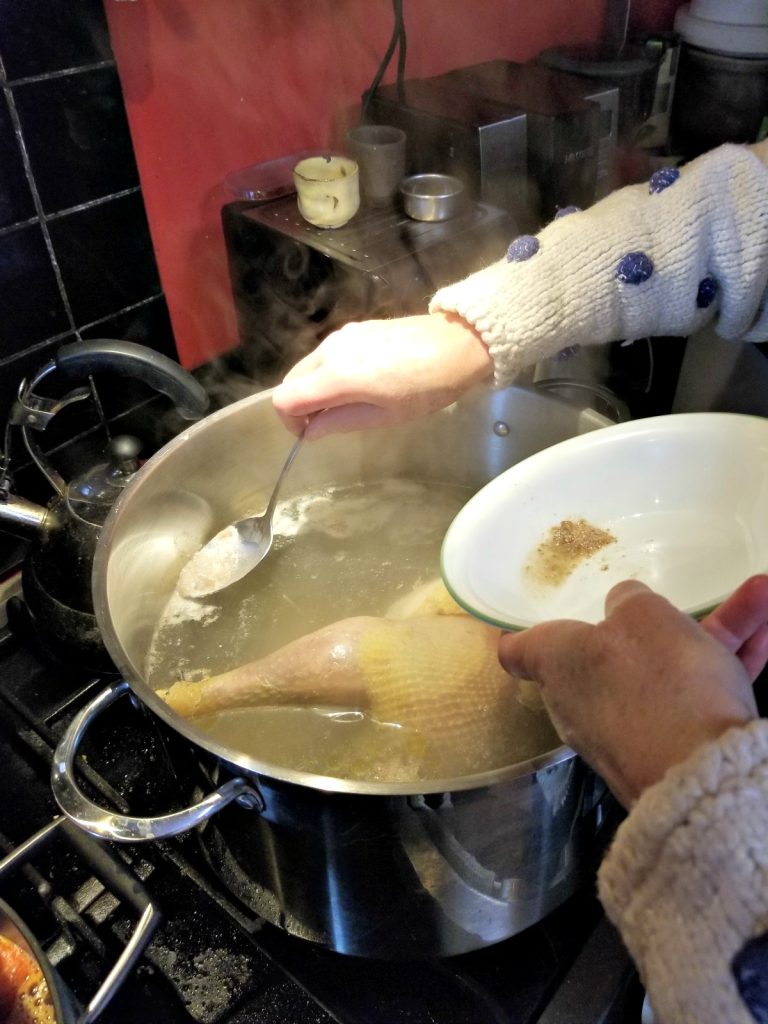 skim the scum from the homemade chicken soup